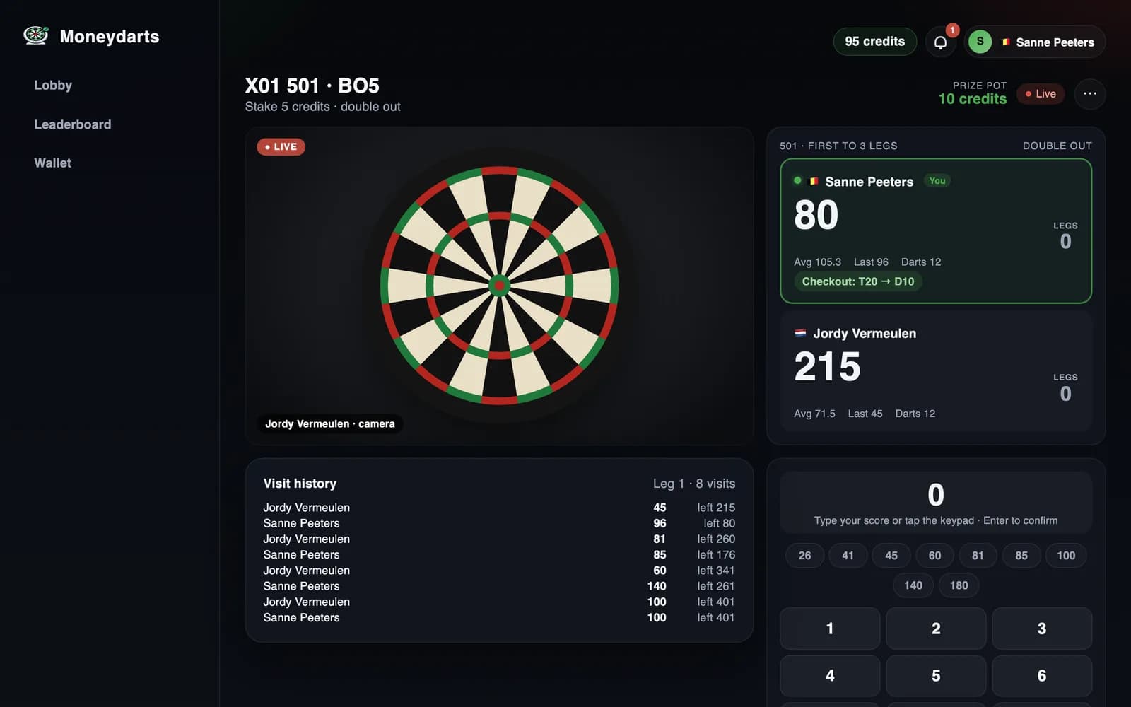 Moneydarts live webcam darts match: opponent's camera view next to a scoreboard showing 80 remaining with a T20 D10 checkout
